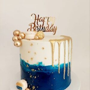 Royal blue, white and gold cake