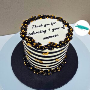 Gold, black & white anniversary cake
